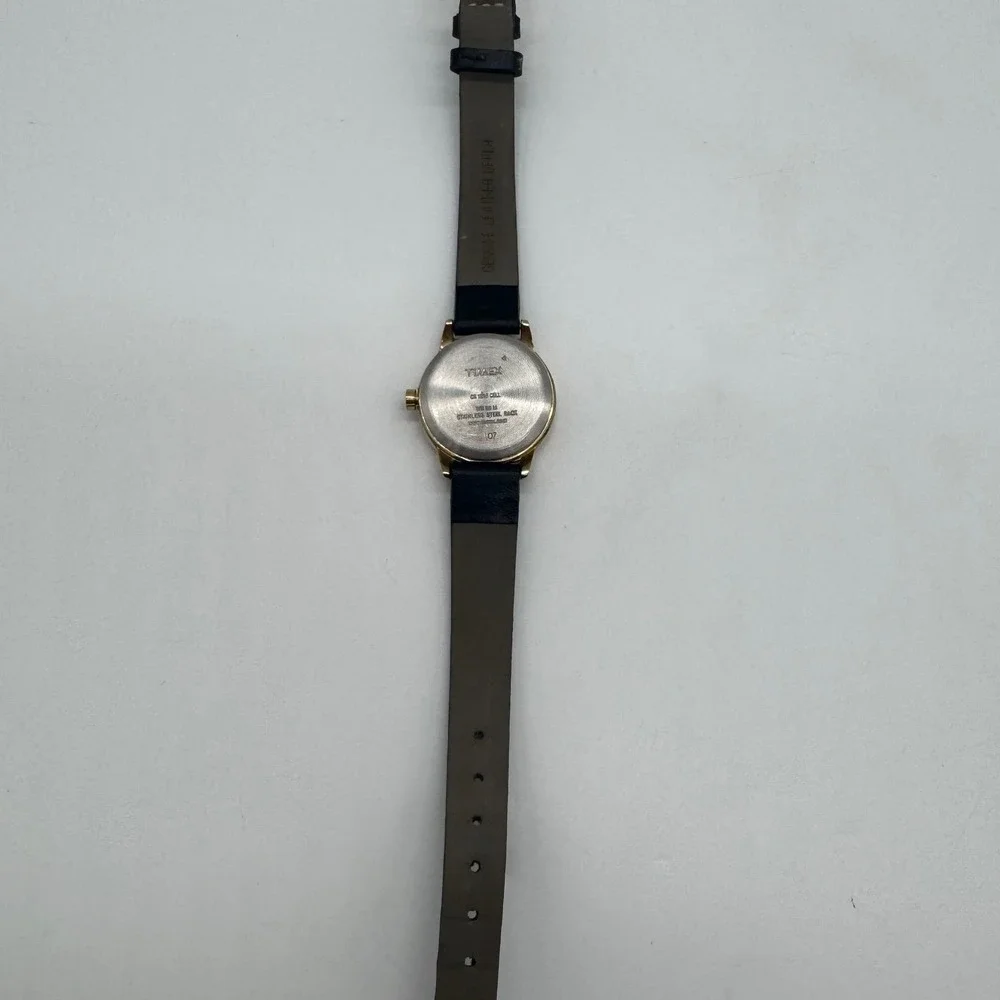 Timex Indiglo WR 30M Gold Tone White Dial Black Leather Watch CR 1216 needs bat